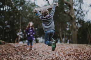 kids playing by swing