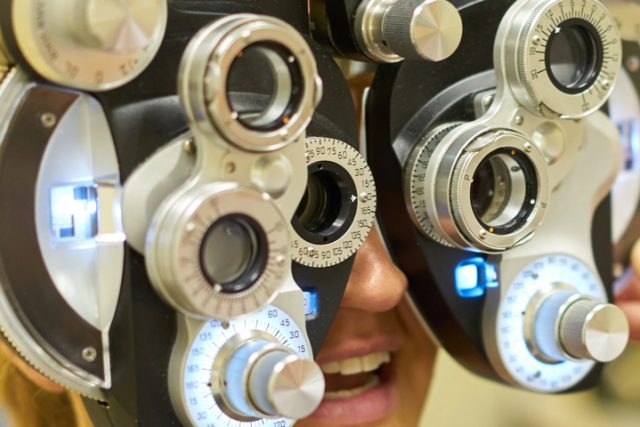 Woman smiling during and eye exam