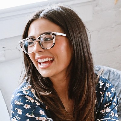 happy woman wearing vera bradley eyeglasses