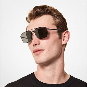 man wearing dark tinted michael kors sunglasses