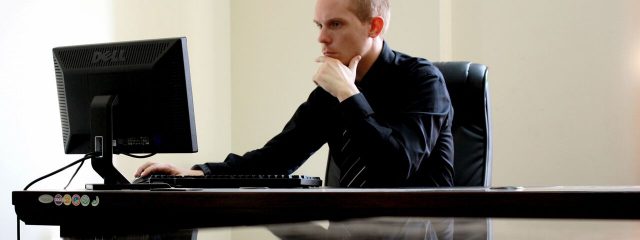 man looking at computer, digital eyestrain treatment near you