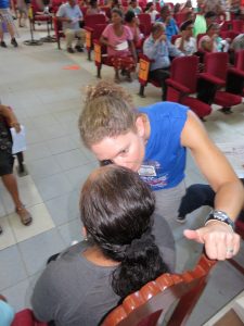Volunteer Eye Doctor talking to a patient in Peru, Optometrist from Colorado Springs, CO