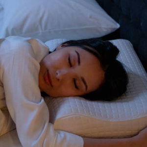 woman sleeping on a white memoryfoam pillow