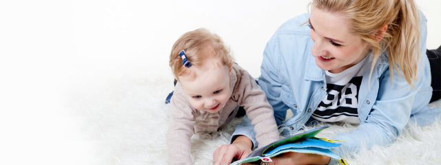 Young Mother Reading to Baby 1280x480 640x240