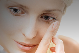 Woman Inserting A Contact Lens